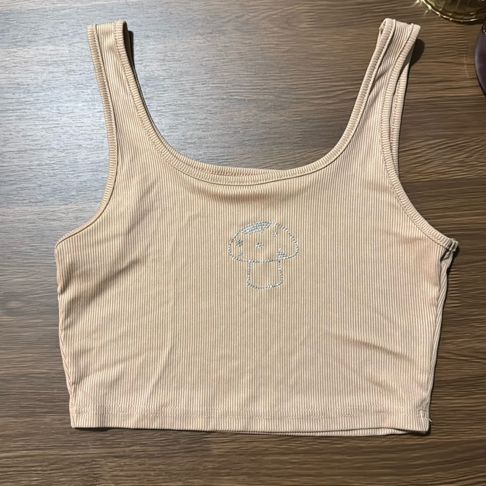 Tan cropped tank top with rhinestoned mushroom